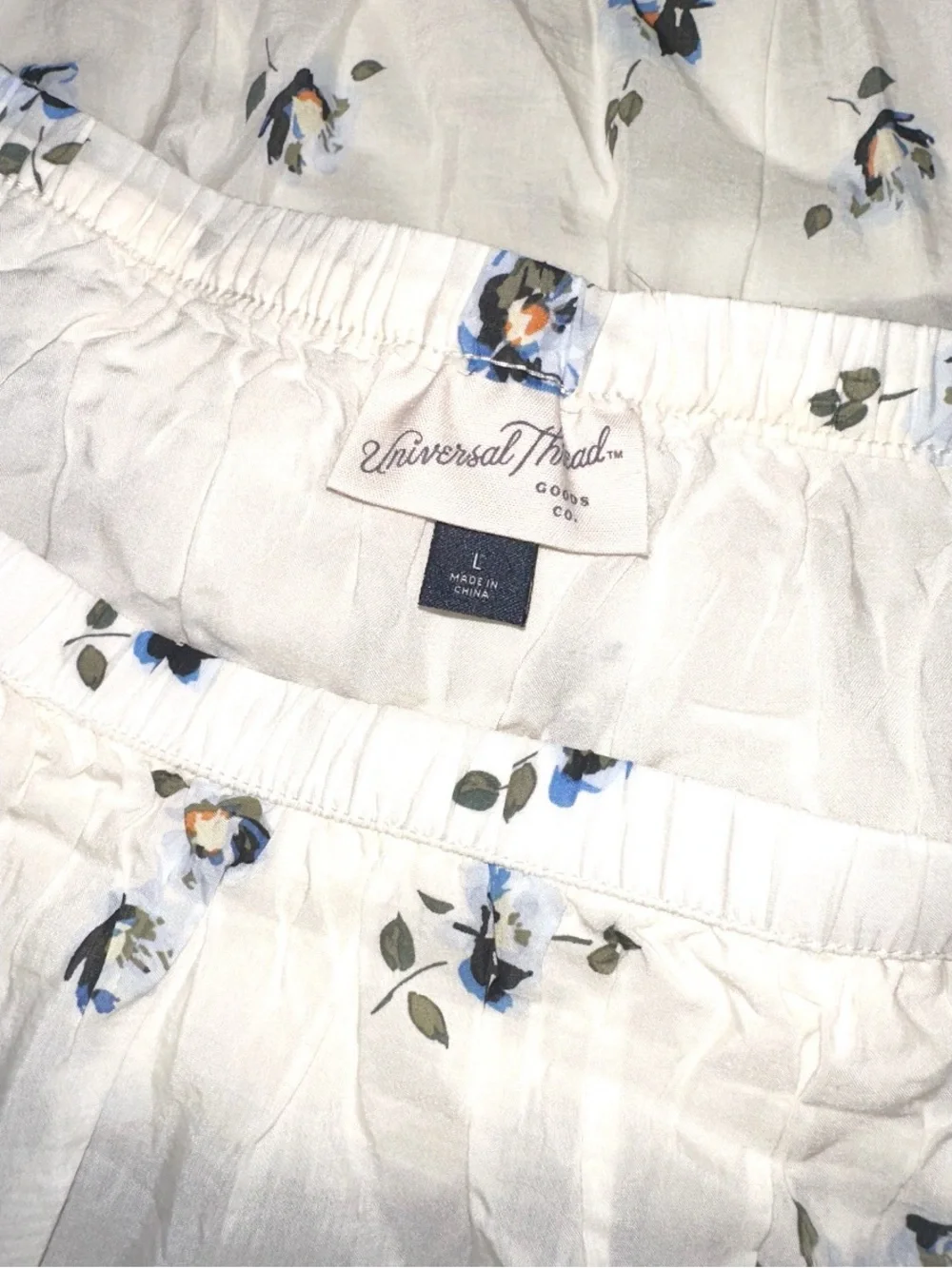 Universal Thread cream mini skirt features ruffled tiers & blue floral pattern